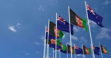Afghanistan and New Zealand Flags Waving Together in the Sky, Seamless Loop in Wind, Space on Left Side for Design or Information, 3D Rendering video
