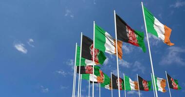 Afghanistan and Ireland Flags Waving Together in the Sky, Seamless Loop in Wind, Space on Left Side for Design or Information, 3D Rendering video