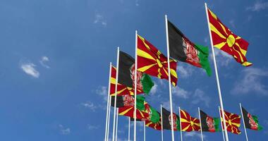 Afghanistan and North Macedonia Flags Waving Together in the Sky, Seamless Loop in Wind, Space on Left Side for Design or Information, 3D Rendering video