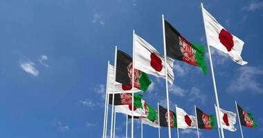 Afghanistan and Japan Flags Waving Together in the Sky, Seamless Loop in Wind, Space on Left Side for Design or Information, 3D Rendering video