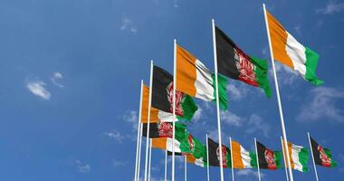Afghanistan and Ivory Coast Flags Waving Together in the Sky, Seamless Loop in Wind, Space on Left Side for Design or Information, 3D Rendering video