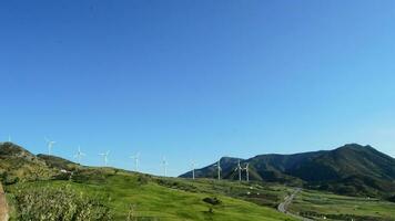 Wind turbines energy renewable in a field a sunny day video