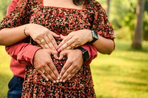 Indian couple posing for Maternity shoot pose for welcoming new born baby in Lodhi Road in Delhi India, Maternity photo shoot done by parents for welcoming their child, Pre Baby Photo Shoot