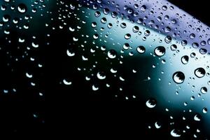 Rain drops cling to the car windshield, selective focus, soft focus. photo