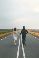 Young loving couple run together to meet new adventures in Almere, netherlands during sunset photo