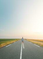 Brown-haired man in a checked shirt walks along a road at sunset on the outskirts of Almere, Netherlands. Fashion lifestyle photo