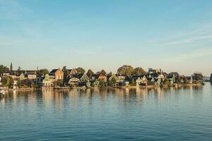 Famous Dutch village Zaanse Schans just outside Amsterdam. Fabulous unique buildings. Historic tourist destination for cheese making photo