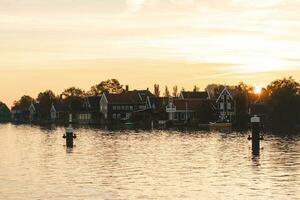 Famous Dutch village Zaanse Schans just outside Amsterdam. Fabulous unique buildings. Historic tourist destination for cheese making photo