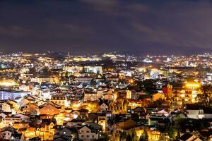 View on roofs in the city of Dalat. Da Lat and the surrounding area is a popular tourist destination of Asia. City with fogs and mountains photo