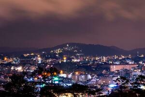 View on roofs in the city of Dalat. Da Lat and the surrounding area is a popular tourist destination of Asia. City with fogs and mountains photo