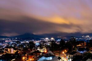 View on roofs in the city of Dalat. Da Lat and the surrounding area is a popular tourist destination of Asia. City with fogs and mountains photo