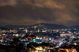 View on roofs in the city of Dalat. Da Lat and the surrounding area is a popular tourist destination of Asia. City with fogs and mountains photo