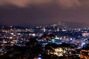 View on roofs in the city of Dalat. Da Lat and the surrounding area is a popular tourist destination of Asia. City with fogs and mountains photo