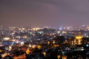 View on roofs in the city of Dalat. Da Lat and the surrounding area is a popular tourist destination of Asia. City with fogs and mountains photo