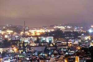 View on roofs in the city of Dalat. Da Lat and the surrounding area is a popular tourist destination of Asia. City with fogs and mountains photo