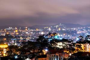 View on roofs in the city of Dalat. Da Lat and the surrounding area is a popular tourist destination of Asia. City with fogs and mountains photo