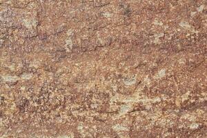 Mountain rock texture. Natural brown slate granite slab marble stone ceramic seamless tile rough surface background. Architecture grunge modern abstract style element. Close-up, copy space photo