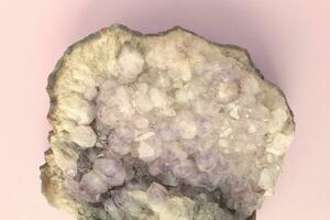Natural amethyst druse geode mineral crystal unpolished semi-precious gemstone. Magic rock for ritual, witchcraft, spiritual practice, meditation. Esoteric life balance concept. Copy space photo