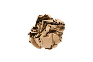 Crumpled paper in the form of a ball isolated on a white background. Top view. Selective focus. photo