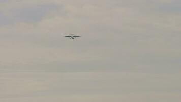 Turboprop aircraft approaching landing, front view. Plane Airplane in the sky video