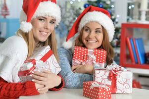 Girls in Santa hat preparing for Christmas photo