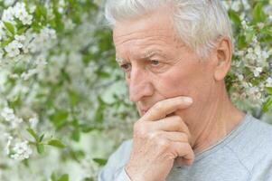 Close up portrait of unhappy senior woman photo