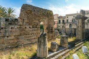 Syracuse, Italy-May 9, 2022-View of the beautiful temple of Apollo,  the oldest in Sicily during a sunny day photo