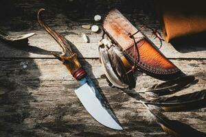 Frontier knife handle with horn and leather sheath is handmade in Thailand photo