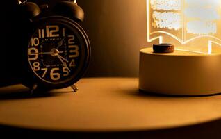 Close-up of a black alarm clock, early morning photo