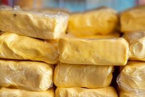 Pile of packaged butter photo
