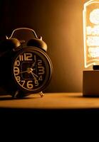 Close-up of a black alarm clock, early morning photo