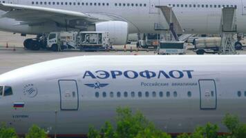 PHUKET, THAILAND - NOVEMBER 28, 2019. Boeing 777, VP-BHA of Aeroflot plane on the runway at Phuket airport, Thailand video