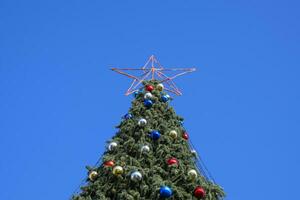 Decorations New Year tree. Tinsel and toys, balls and other deco photo