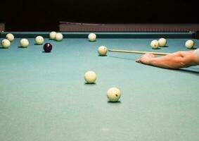 Billiards, billiard table. Targeting the cue in the ball for imp photo