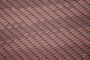 Decorative metal tile on a roof photo