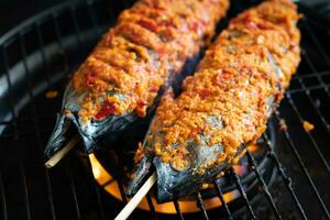 Grilled skipjack tuna or cakalang with delicious spicy seasoning photo