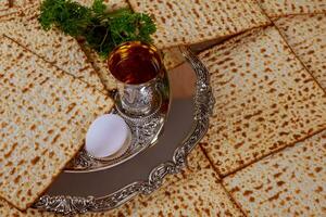 Jewish holiday Passover background matzo and wine photo
