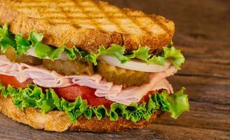 Homemade Turkey Sandwich with Lettuce Tomato Onion photo