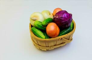 Assortment of fresh vegetables wooden background photo