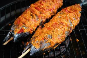 Grilled skipjack tuna or cakalang with delicious spicy seasoning photo