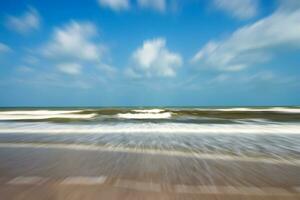 Motion image of Waves and cloud in the summer. Out of focus image. photo