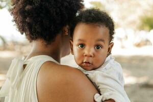 Portrait of newborn boy looking at camera. photo