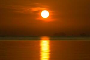 Sunset sky on the lake in south of Thailand., un-focus image. photo