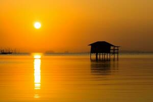 Home stay with Sunset sky on the lake in south of Thailand. photo