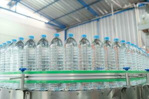 Closeup on mineral water bottles in raw and lines photo