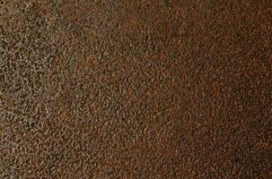 Rusty grunge on dark metal texture background. photo