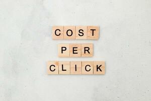 Top view of Cost Per Click word on wooden cube letter block on white background. Business concept photo