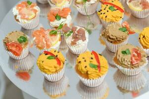 Cake snack with different flavors and sea fish photo