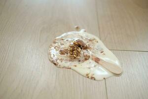 ice cream melting and spilling on floor , photo