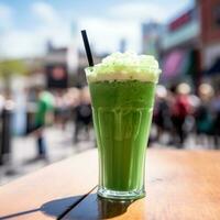 AI generated pint of green beer with a blurred St. Patrick's Day parade in the background. photo